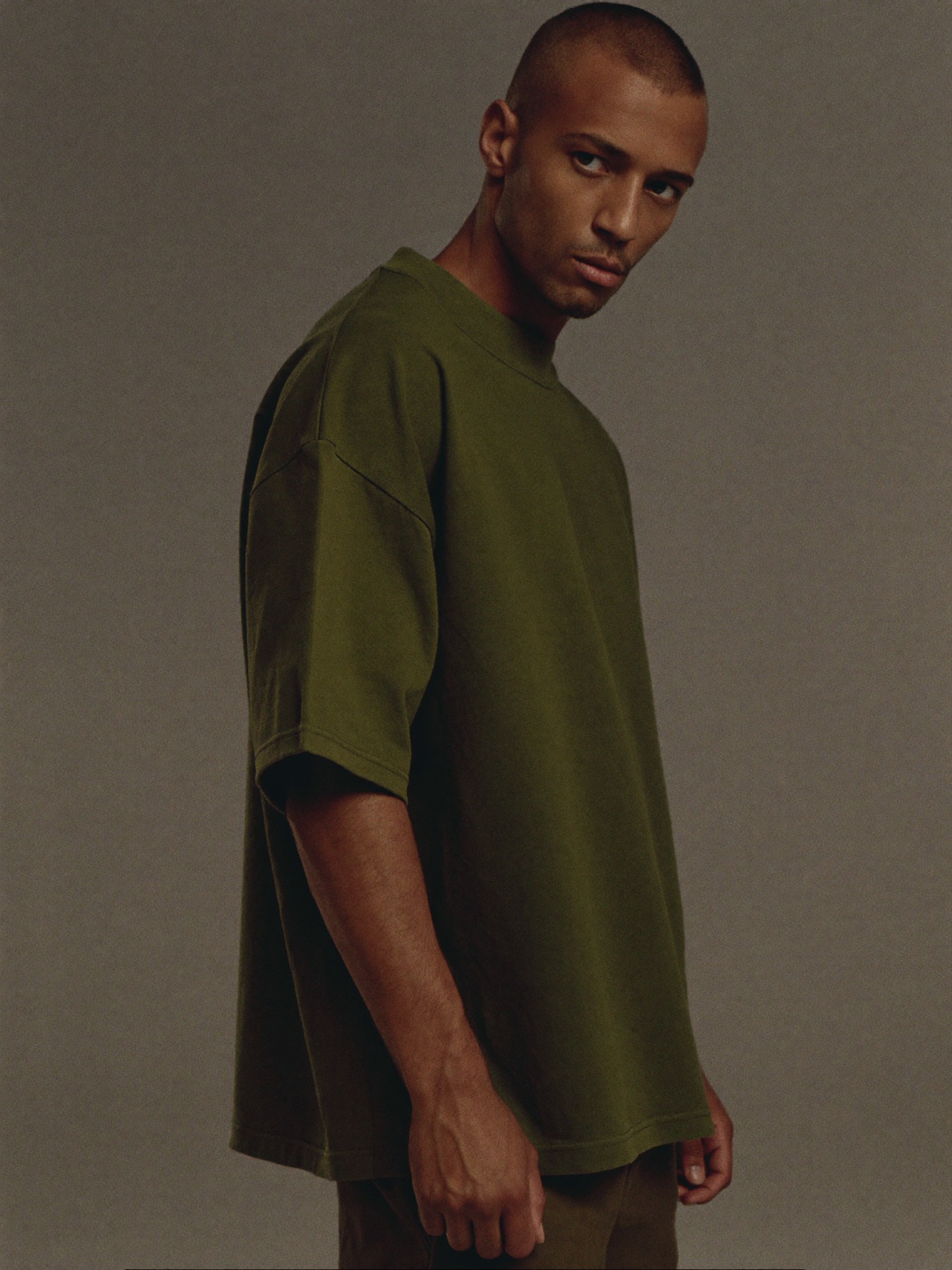 Model wearing the Olive heavyweight tee